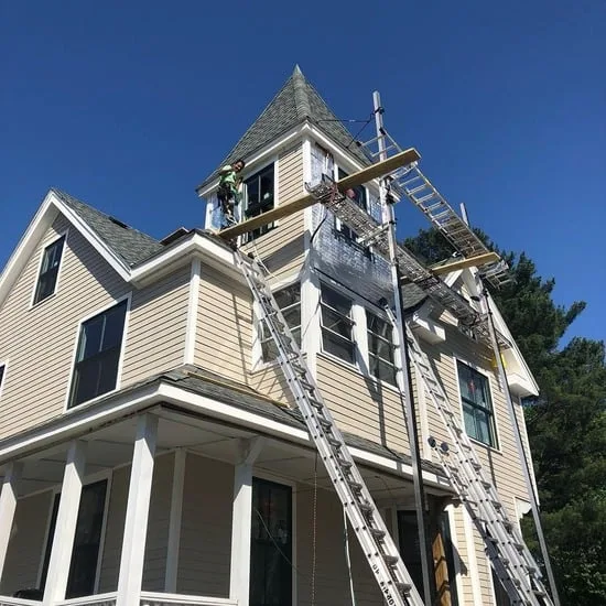 Wide-angle perspective of the completed siding sections on a residential Everlast siding Melrose MA job site.
