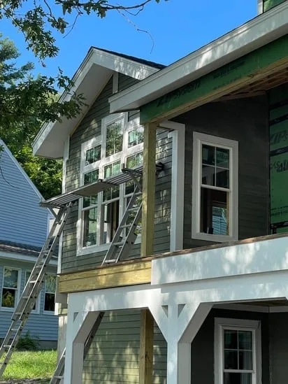 Close-up of Lunemburg Hardie Plank Siding installation on a gable with white PVC trim.